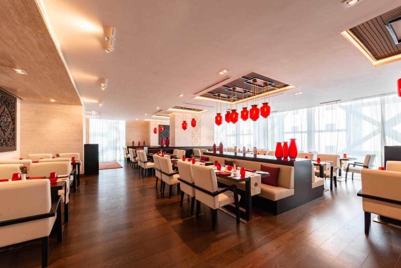 Shaza Doha Hotel Bagian luar foto The interior of the restaurant